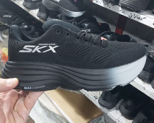 S K X
